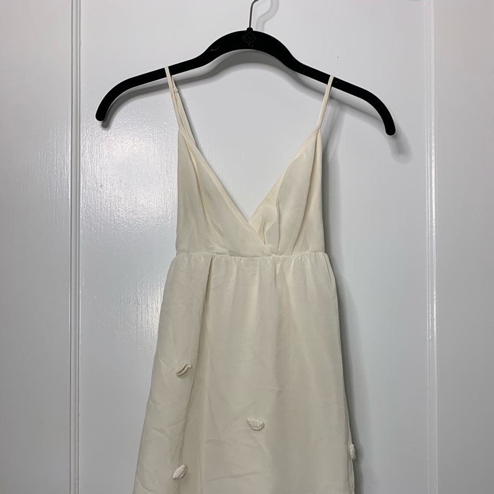 White dress with embroidered seashells